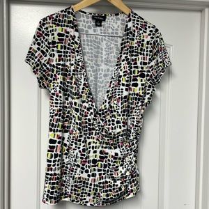 Black, white wrap shirt, size L. Matching skirt in closet!